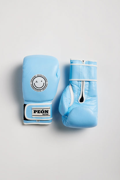 two baby blue boxing gloves with a smile logo 